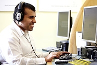 man with sight loss using an adapted computer